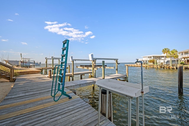 316 Quivira St, Dauphin Island, AL 36528 - view of dock featuring boat lift and a water view