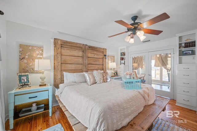 316 Quivira St, Dauphin Island, AL 36528 - bedroom featuring visible vents, a ceiling fan, wood finished floors, french doors, and access to outside