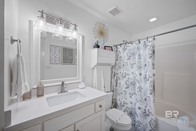 316 Quivira St, Dauphin Island, AL 36528 - full bath with shower / tub combo with curtain, vanity, visible vents, and toilet