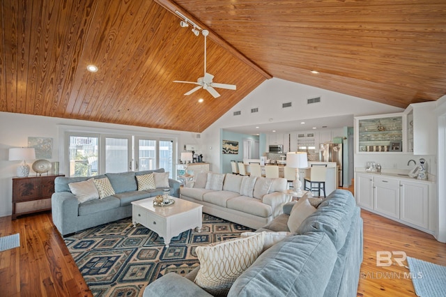316 Quivira St, Dauphin Island, AL 36528 - living area with light wood-style floors, ceiling fan, visible vents, and wood ceiling