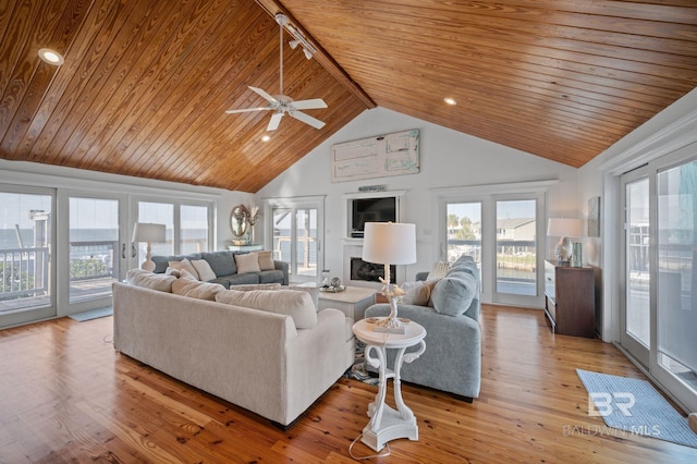 316 Quivira St, Dauphin Island, AL 36528 - living area with light wood-style floors, ceiling fan, plenty of natural light, and wood ceiling