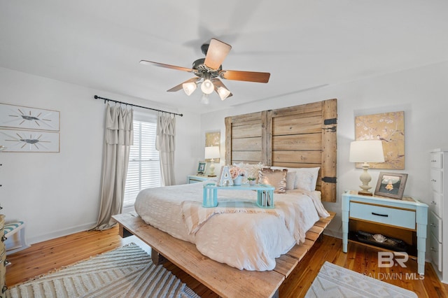 316 Quivira St, Dauphin Island, AL 36528 - bedroom with wood finished floors, ceiling fan, and baseboards