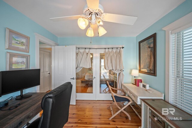 316 Quivira St, Dauphin Island, AL 36528 - office with light wood-style floors, a ceiling fan, and french doors