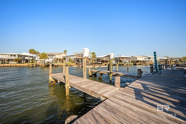 316 Quivira St, Dauphin Island, AL 36528 - dock area with a water view and a residential view