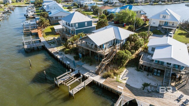 316 Quivira St, Dauphin Island, AL 36528 - drone / aerial view featuring a residential view and a water view