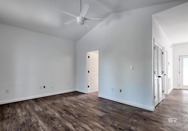 empty room with a ceiling fan, baseboards, high vaulted ceiling, and dark wood finished floors