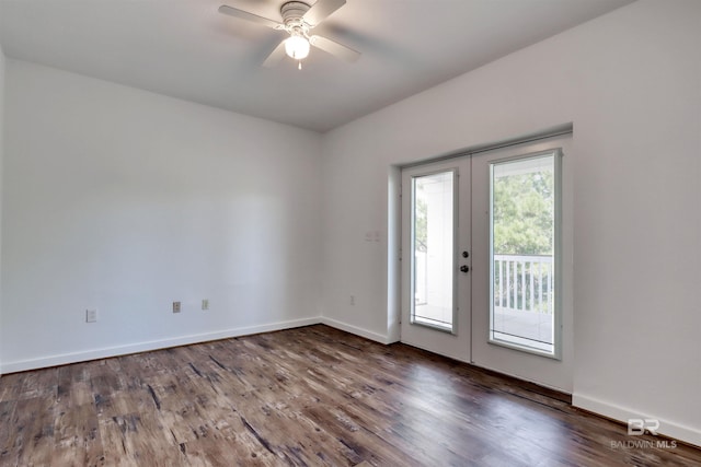 unfurnished room featuring baseboards, a ceiling fan, french doors, and wood finished floors