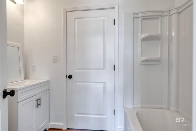 full bathroom featuring a bath, vanity, and a shower