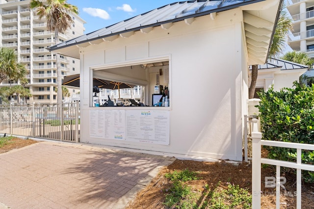 375 Beach Club Dr Unit 1801, Gulf Shores, AL 36542 - view of property exterior featuring stucco siding, a standing seam roof, and metal roof