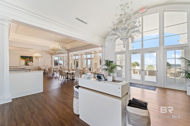 375 Beach Club Dr Unit 1801, Gulf Shores, AL 36542 - kitchen with french doors, a chandelier, crown molding, dark wood-type flooring, and pendant lighting