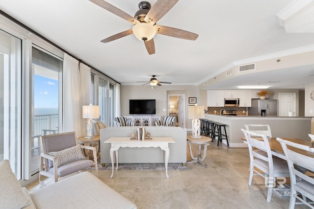 375 Beach Club Dr Unit 1801, Gulf Shores, AL 36542 - living area with ceiling fan and ornamental molding
