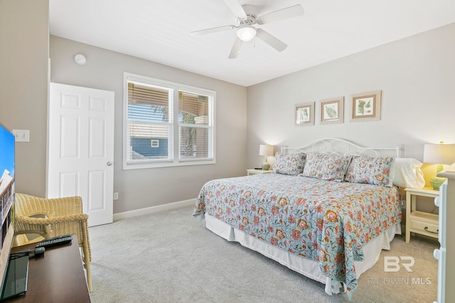 bedroom with light carpet and ceiling fan