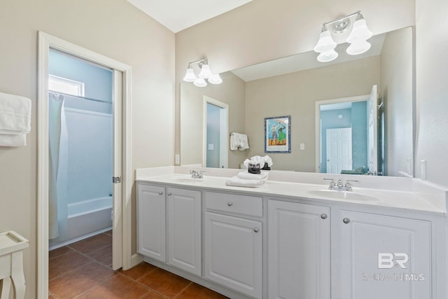 bathroom featuring shower / bath combination with curtain, tile patterned flooring, and vanity