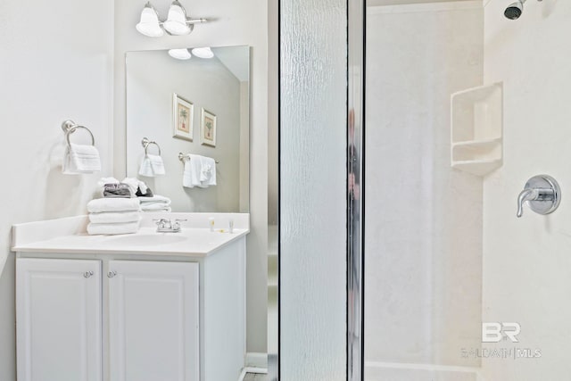 bathroom with a shower and vanity