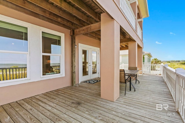 wooden deck featuring french doors