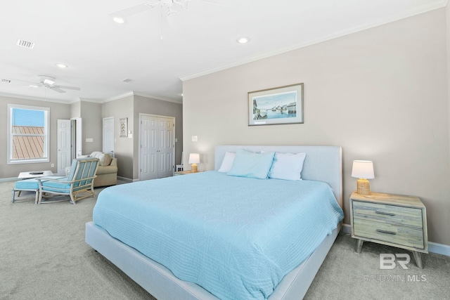 carpeted bedroom with crown molding and ceiling fan
