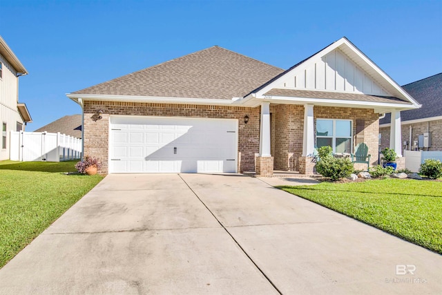 view of front of house with a front yard and a garage