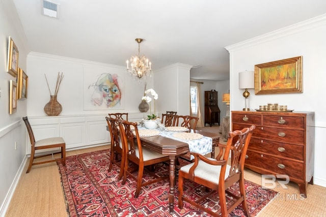 dining room with light carpet, ornamental molding, and a notable chandelier