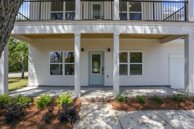 5099 Leeward Dr, Pensacola, FL 32507 - doorway to property featuring a balcony and a porch