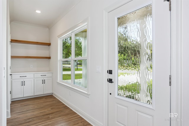 5099 Leeward Dr, Pensacola, FL 32507 - doorway featuring healthy amount of natural light, wood finished floors, and baseboards