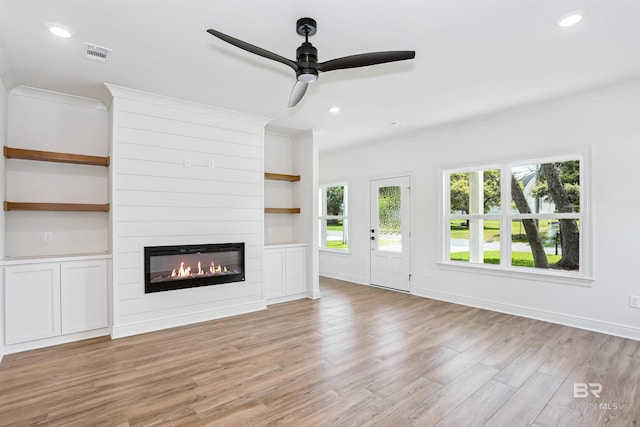 5099 Leeward Dr, Pensacola, FL 32507 - unfurnished living room featuring ornamental molding, light wood-style flooring, a large fireplace, a ceiling fan, and recessed lighting