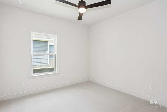 5099 Leeward Dr, Pensacola, FL 32507 - empty room featuring light colored carpet, a ceiling fan, and baseboards