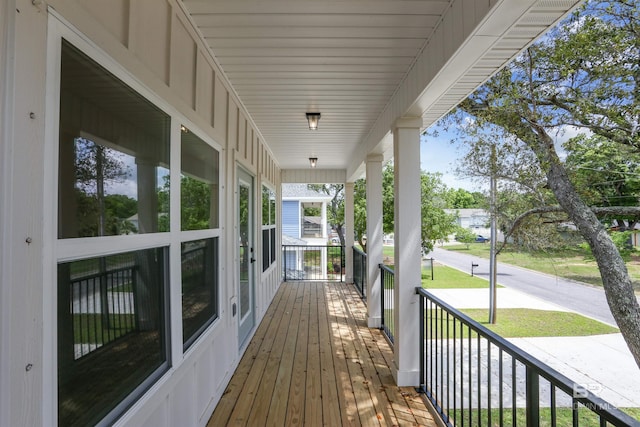 5099 Leeward Dr, Pensacola, FL 32507 - wooden deck featuring covered porch