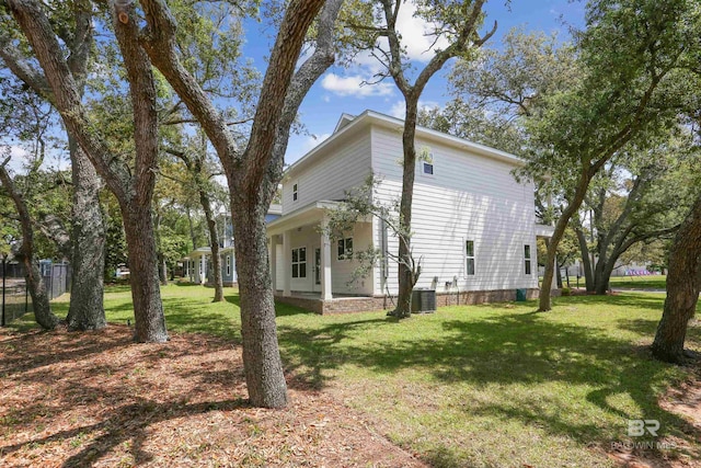 5099 Leeward Dr, Pensacola, FL 32507 - view of side of home with a yard