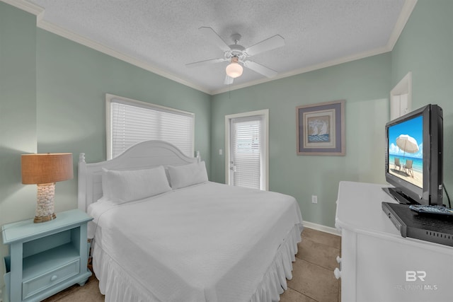 bedroom with ceiling fan, crown molding, and a textured ceiling