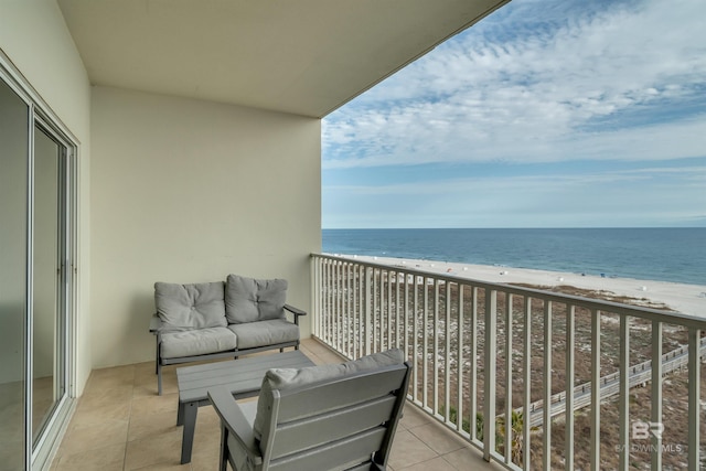 balcony with a beach view and a water view