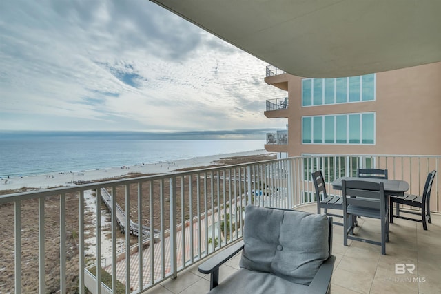 balcony with a beach view and a water view