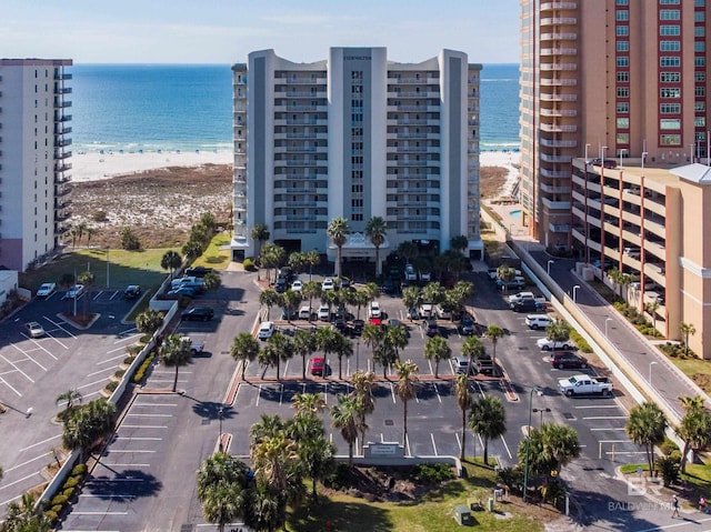 birds eye view of property featuring a water view and a view of the beach