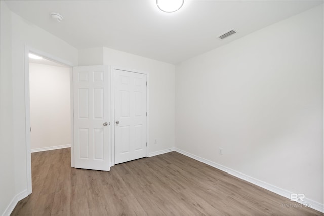 16063 Mansion St, Foley, AL 36535 - unfurnished bedroom with wood finished floors and baseboards