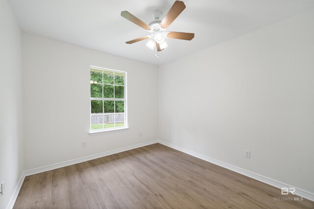 16063 Mansion St, Foley, AL 36535 - unfurnished room featuring wood finished floors, baseboards, and a ceiling fan