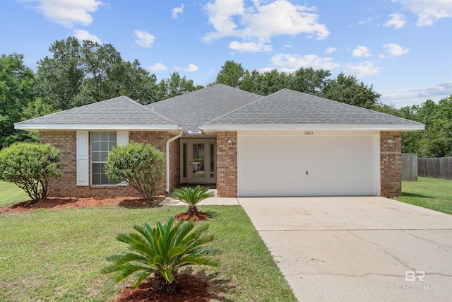 16063 Mansion St, Foley, AL 36535 - ranch-style home with brick siding, a shingled roof, an attached garage, and concrete driveway