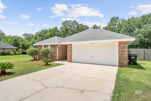16063 Mansion St, Foley, AL 36535 - ranch-style house with brick siding, roof with shingles, an attached garage, and concrete driveway