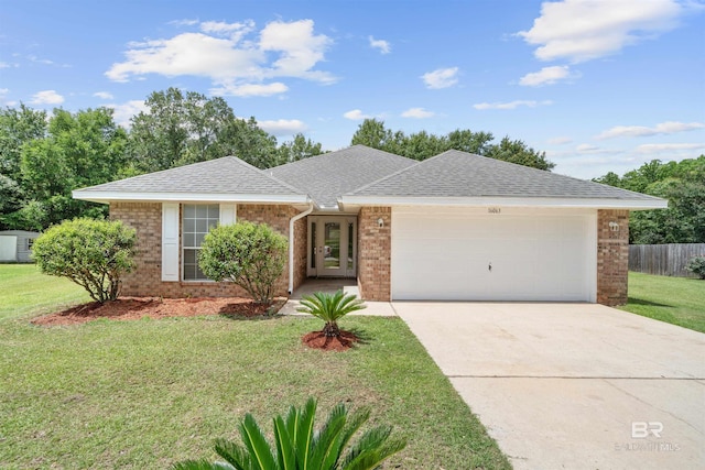 16063 Mansion St, Foley, AL 36535 - ranch-style home featuring an attached garage, brick siding, concrete driveway, and a shingled roof