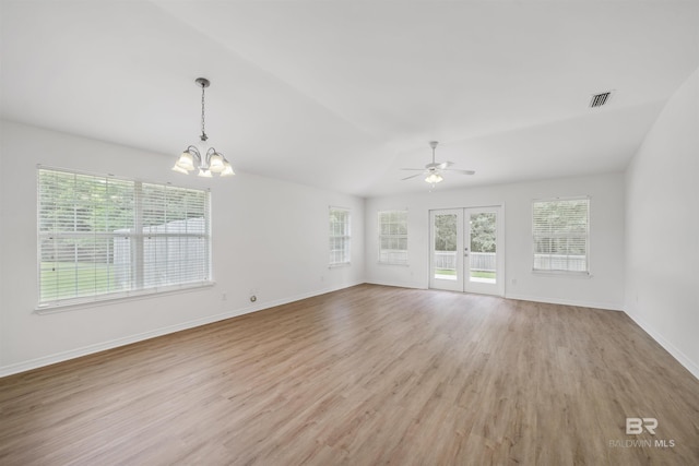 16063 Mansion St, Foley, AL 36535 - unfurnished living room featuring ceiling fan, light wood finished floors, baseboards, a chandelier, and french doors