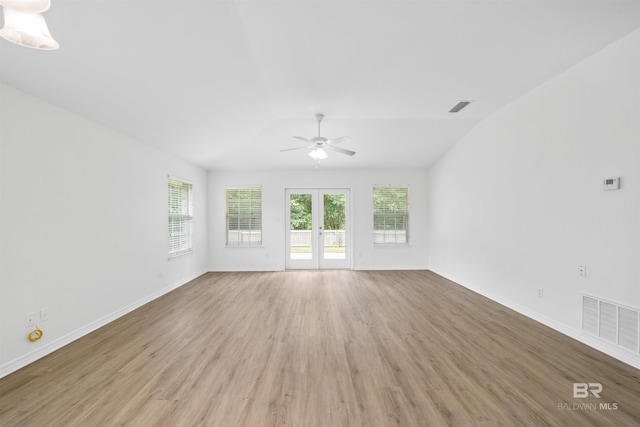 16063 Mansion St, Foley, AL 36535 - unfurnished living room with ceiling fan, healthy amount of natural light, light wood-style floors, baseboards, and vaulted ceiling