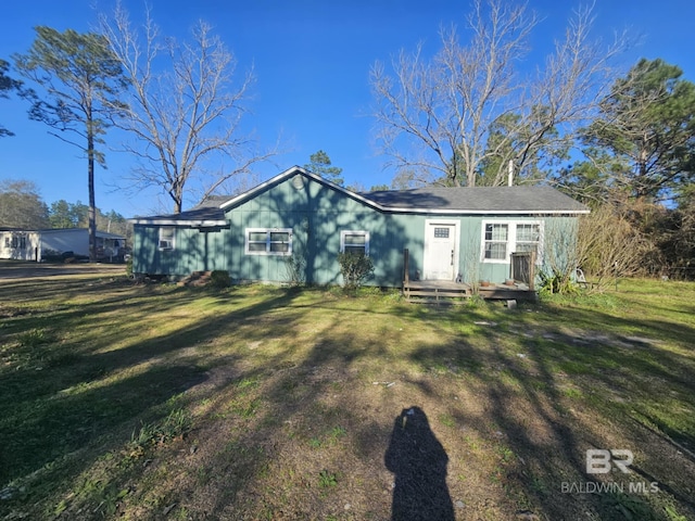 ranch-style house with a front lawn