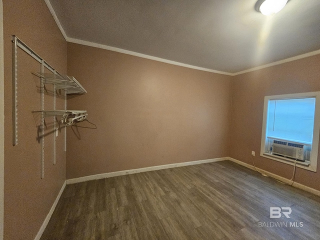 31398 Brady Rd, Robertsdale, AL 36567 - spare room with ornamental molding, cooling unit, baseboards, and wood finished floors