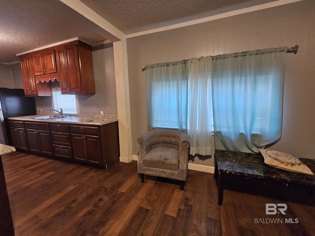 31398 Brady Rd, Robertsdale, AL 36567 - living area with dark wood-style floors, crown molding, a textured ceiling, and baseboards