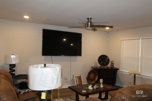 living room with hardwood / wood-style flooring and ceiling fan