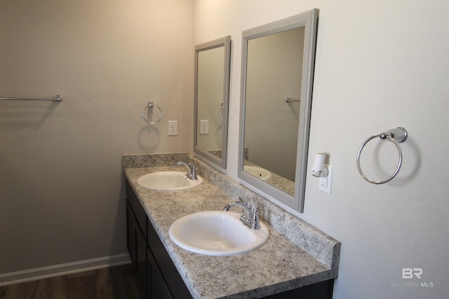 bathroom featuring vanity and hardwood / wood-style floors