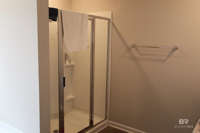 bathroom featuring an enclosed shower