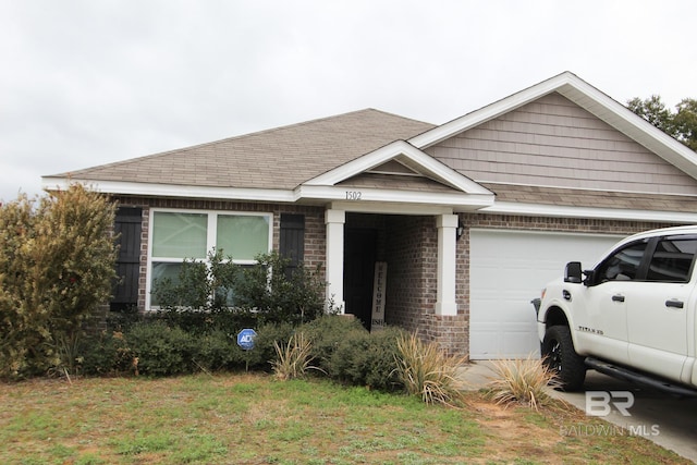 view of front of house with a garage and a front lawn