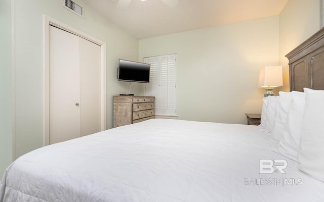 bedroom featuring visible vents, a closet, and ceiling fan