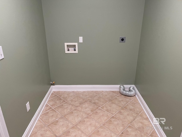 laundry area featuring electric dryer hookup, gas dryer hookup, light tile patterned flooring, and washer hookup