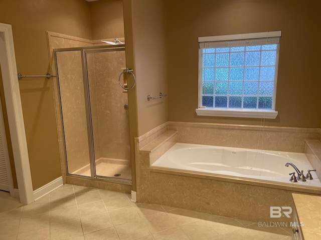 bathroom featuring tile patterned flooring and plus walk in shower