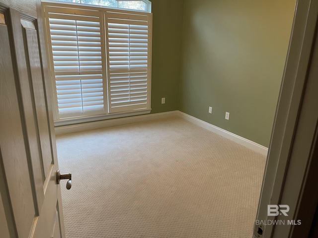 unfurnished room featuring carpet floors